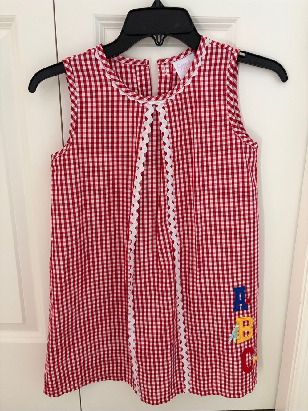 Stitchy Fish red checkered spelling dress size 7 girls. Back to school